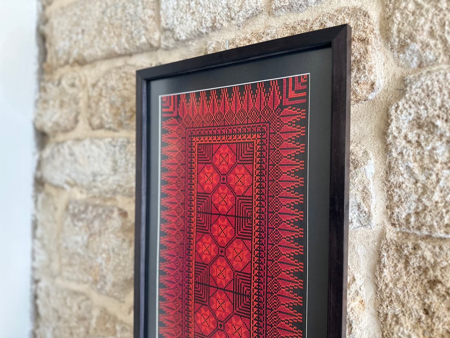 Framed one-of-a-kind red embroidery from Hebron