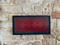 Framed one-of-a-kind red embroidery from Hebron