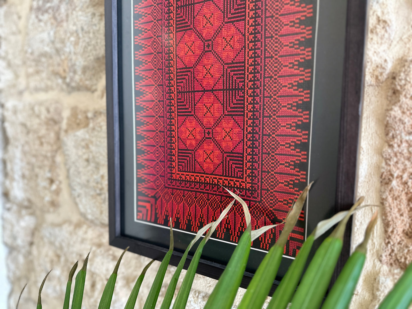 Framed one-of-a-kind red embroidery from Hebron